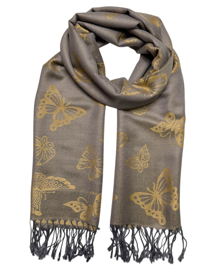A grey and gold reversible pashmina scarf with a butterfly design, fringed ends, and a knotted tie at the center.