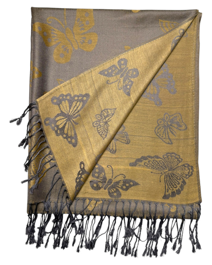 A grey and gold reversible pashmina scarf with a butterfly design, fringed ends, and a knotted tie at the center.